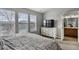 Main bedroom with ensuite bathroom and ample natural light at 985 Burning Bush Pt, Monument, CO 80132