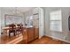 Kitchen with light wood cabinets, black appliances, and an island at 985 Burning Bush Pt, Monument, CO 80132