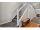 Staircase with white railing and wooden bench at the bottom at 985 Burning Bush Pt, Monument, CO 80132