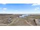 Aerial view showcasing walking trails, lake, open space, and community at 26741 E Arbor Dr, Aurora, CO 80016