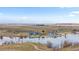 Aerial view of community beach, walking trails, community area, and lake at 26741 E Arbor Dr, Aurora, CO 80016