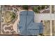 Drone's-eye view of property showing the backyard landscaping, fire pit, and deck at 26741 E Arbor Dr, Aurora, CO 80016