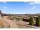 Spacious backyard with professionally landscaped yard, patio and fire pit overlooking the water at 26741 E Arbor Dr, Aurora, CO 80016