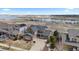 Beautiful two-story home with a well-manicured lawn and lake view at 26741 E Arbor Dr, Aurora, CO 80016