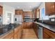 Kitchen featuring stainless steel appliances, wood cabinets, and an island with a gas cooktop at 26741 E Arbor Dr, Aurora, CO 80016