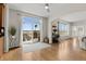 Open living area with hardwood floors, sliding glass doors to the patio, and views at 26741 E Arbor Dr, Aurora, CO 80016