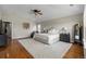 Charming bedroom with a plush rug, fan, and ample natural light from the windows at 26741 E Arbor Dr, Aurora, CO 80016