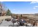 Outdoor patio featuring comfortable seating and stunning lake views for relaxation and entertainment at 26741 E Arbor Dr, Aurora, CO 80016