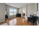 Comfortable sitting area with hardwood floors and a view of the peaceful landscape at 26741 E Arbor Dr, Aurora, CO 80016