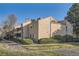 Exterior of a charming townhome featuring well-maintained landscaping at 15136 E Louisiana Dr # 106, Aurora, CO 80012