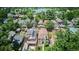 Aerial view of a home in a neighborhood near a lake surrounded by mature trees at 639 S Williams St, Denver, CO 80209