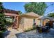 Exterior view of the backyard with a dining area, outdoor seating, and stone patio at 639 S Williams St, Denver, CO 80209