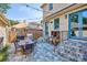 Backyard patio with an outdoor kitchen area, dining table, and stone pavers at 639 S Williams St, Denver, CO 80209