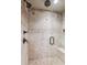 Walk-in shower featuring dual shower heads and tiled walls at 639 S Williams St, Denver, CO 80209