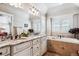 Luxurious bathroom with dual sinks, granite countertops, and a soaking tub at 639 S Williams St, Denver, CO 80209