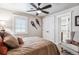 Bedroom featuring a ceiling fan, closet, and ensuite bathroom for a blend of style and convenience at 639 S Williams St, Denver, CO 80209