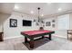 Basement billiard room featuring a pool table with overhead lighting and carpeted floors at 639 S Williams St, Denver, CO 80209