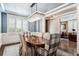 Elegant dining room featuring a crystal chandelier, wainscoting, and hardwood floors at 639 S Williams St, Denver, CO 80209