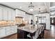 Spacious kitchen with large island featuring granite countertops, pendant lighting, and seating for casual dining at 639 S Williams St, Denver, CO 80209