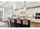 Bright kitchen with white cabinets, granite countertops, a large island, and stainless steel appliances at 639 S Williams St, Denver, CO 80209