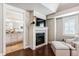 Main bedroom showcasing a fireplace and a view to the ensuite bathroom at 639 S Williams St, Denver, CO 80209