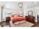 Sunlit main bedroom featuring a beautiful dresser, nightstands, and warm decor at 639 S Williams St, Denver, CO 80209