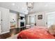 Bright and inviting main bedroom featuring a fireplace, chair, and an ensuite bath at 639 S Williams St, Denver, CO 80209