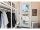 Functional mudroom with built-in storage, coat hooks, and a view of the stone-walled outdoor space at 639 S Williams St, Denver, CO 80209