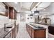 Sophisticated wet bar featuring custom cabinets, granite countertops, and stylish lighting at 639 S Williams St, Denver, CO 80209