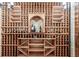 Custom wine cellar with wooden racking for bottle storage and display at 639 S Williams St, Denver, CO 80209