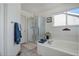 Bathroom with shower, bathtub, and plenty of counter space at 6474 S Jericho Cir, Centennial, CO 80016