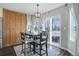 Bright kitchen nook with wood cabinets and sliding glass doors to backyard at 6474 S Jericho Cir, Centennial, CO 80016