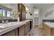 Bathroom showcasing dual sinks, modern cabinetry, and a separate bathtub area at 5558 Malta St, Denver, CO 80249