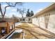 Spacious backyard with new wooden fence, lush lawn, and a single-story home addition at 404 S Jasmine St, Denver, CO 80224