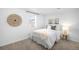 Cozy bedroom with neutral carpet, window and white walls showcasing a simple design at 404 S Jasmine St, Denver, CO 80224