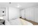 This comfortable bedroom with a built-in shelf and closet offers a bright and airy feel at 404 S Jasmine St, Denver, CO 80224