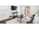 The living room features hardwood floors, a sliding door, and modern furnishings at 404 S Jasmine St, Denver, CO 80224