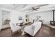 Bright living room with hardwood floors, modern furniture, ceiling fan, and a cozy fireplace at 404 S Jasmine St, Denver, CO 80224
