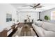 Inviting living space featuring hardwood floors, neutral decor, with an adjacent dining area at 404 S Jasmine St, Denver, CO 80224