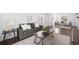 The living room is illuminated by natural light with hardwood floors and modern furnishings at 404 S Jasmine St, Denver, CO 80224