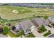 Stunning aerial view of a well-maintained home overlooking a golf course and lush landscaping at 5280 Genoa St, Denver, CO 80249