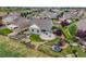 Aerial view of the property showcasing the backyard, patio, garden, and surrounding neighborhood at 5280 Genoa St, Denver, CO 80249