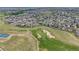 Extensive view of a golf course and the surrounding homes in a well-established community at 5280 Genoa St, Denver, CO 80249