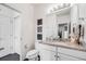 Well-lit bathroom boasts granite countertop, sleek fixtures, and decorative accents at 5280 Genoa St, Denver, CO 80249