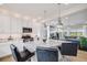 Open concept kitchen with granite counters, stainless appliances and seamless access to the living area at 5280 Genoa St, Denver, CO 80249