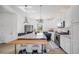Bright kitchen featuring a large island, stainless steel appliances, and white cabinetry at 5280 Genoa St, Denver, CO 80249