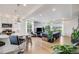 Open floor plan featuring a kitchen island and cozy living area at 5280 Genoa St, Denver, CO 80249