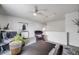 Bright loft with neutral colors, recessed lighting, desk and comfortable seating at 5280 Genoa St, Denver, CO 80249