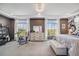 Relaxing bedroom features abundant natural light, stylish decor, and neutral color palette at 5280 Genoa St, Denver, CO 80249