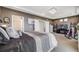 Serene bedroom features decorative bed, recessed lighting, and doorway to the en suite bath at 5280 Genoa St, Denver, CO 80249